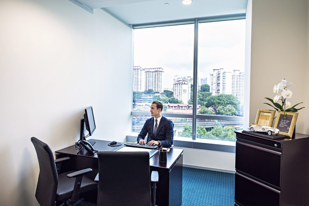 A businessman working from a serviced office in The Metropolis Tower 2, in SIngapore.